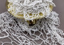 White Decorative Fish Net - (1 Net approx. 3.3 feet x 6.6 feet) on greyish background. Copyright 2022 SeaShellSupply.com.