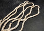 White Puka Seashell Strand (1 strand approx. 16 inches x 4-5+ mm) Beautiful shell strand perfect for a classic gift! Long necklace section of stacked puka shells. Copyright 2024 SeaShellSupply.com