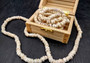 White Puka Seashell Strand (1 strand approx. 16 inches x 4-5+ mm) Beautiful shell strand perfect for a classic gift! Long necklace section of stacked puka shells. Copyright 2024 SeaShellSupply.com