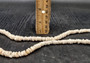 White Puka Seashell Strand (1 strand approx. 16 inches x 4-5+ mm) Beautiful shell strand perfect for a classic gift! Long necklace section of stacked puka shells. Copyright 2024 SeaShellSupply.com