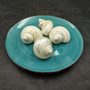 Photo of Pearlized Jade Turbo Shell Turbo Burgessi on a dark background. Reflective white shell. Copyright 2026 SeashellSupply.com