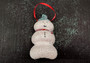 Sea Urchin Snowman Ornament (1 urchin snowman approx. 3-4 inches) on green background. Copyright 2024 SeaShellSupply.com.