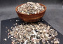 Ocean Mix Tiny Seashells (approx. 750-800 shells .25-.625 inches). Multiple colored shells with different patterns in an intricate pile. Copyright 2025 SeaShellSupply.com.