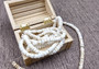 White Puka Style Seashells Drilled Strand (1 strand approx. 16 inches x 4-5+ mm) Copyright 2024 SeaShellSupply.com