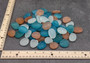 Beach Glass - Rounded Blue, Peach & White Assorted Pebbles - (approx. 1 Kilogram/2.2 lbs. 1-1.5 inches). Multiple colored pebbles in a pile. Copyright 2022 SeaShellSupply.com.