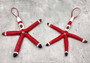 Red Linckia Starfish Black Santa Ornament (1 seastar approx. 4-6 inches)  on green background. Copyright 2022 SeaShellSupply.com.