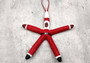 Red Linckia Starfish Black Santa Ornament (1 seastar approx. 4-6 inches)  on green background. Copyright 2022 SeaShellSupply.com.