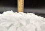 Beach Glass - Small Tumbled Rough Frosty White - (approx. 1 Kilogram/2.2 lbs. .25-1 inches). Multiple stone pebbles in a pile. Copyright 2025 SeaShellSupply.com.