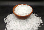 Beach Glass - Small Tumbled Rough Frosty White - (approx. 1 Kilogram/2.2 lbs. .25-1 inches). Multiple stone pebbles in a pile. Copyright 2025 SeaShellSupply.com.