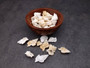 Baby Frog Seashells (10 pcs.) - Biplex Perca. Multiple white ribbed striped shells with wing looking flaps off the side in a pile. Copyright 2022 SeaShellSupply.com.