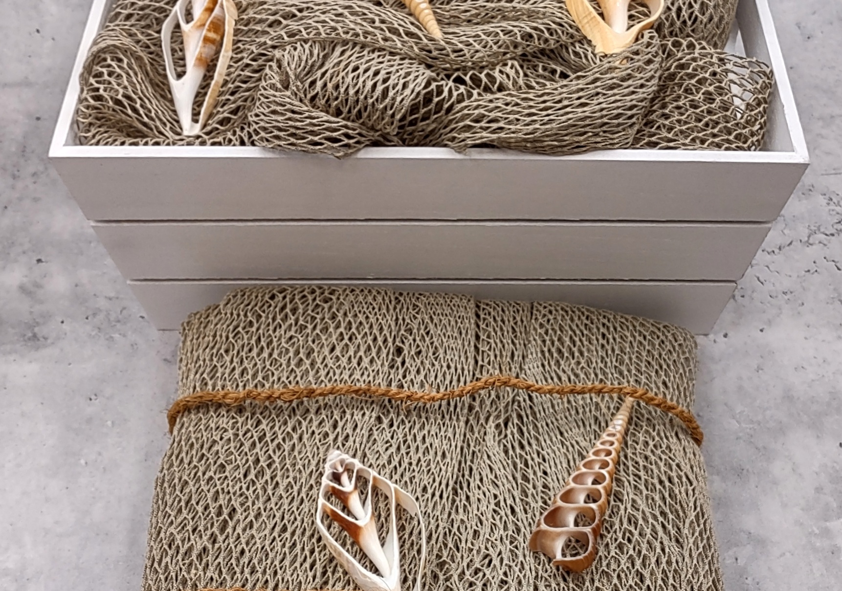 Fishing net with shells and driftwood, maritime