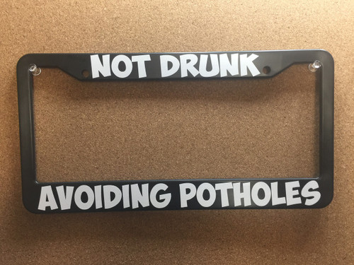 Not drunk avoiding potholes Plate