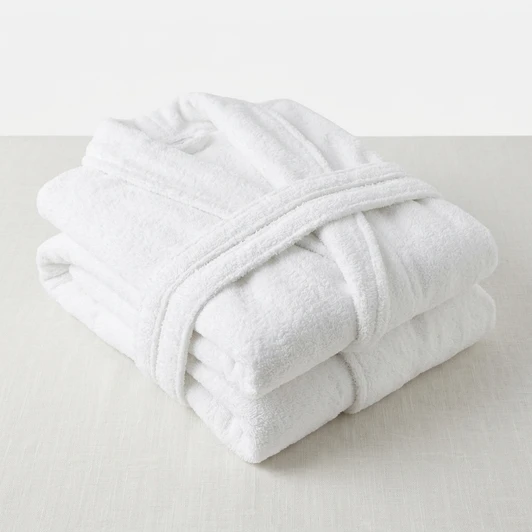 white-terry-towelling-bath-robes-folded-close-up