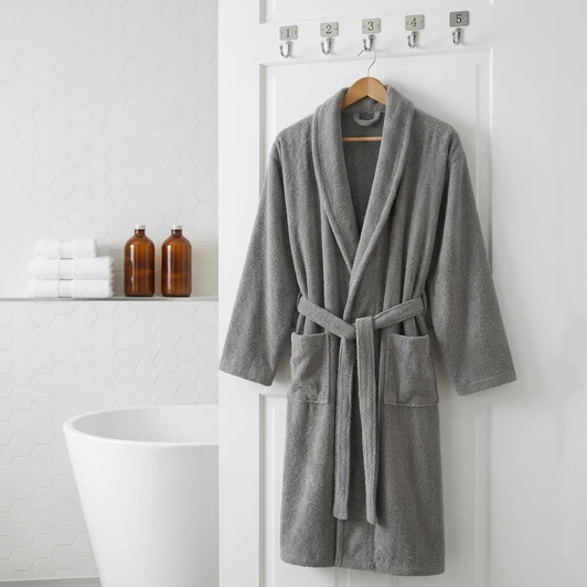 grey-terry-towelling-dressing-gown-hanging-numbered-hooks-hexagon-tile-bathroom
