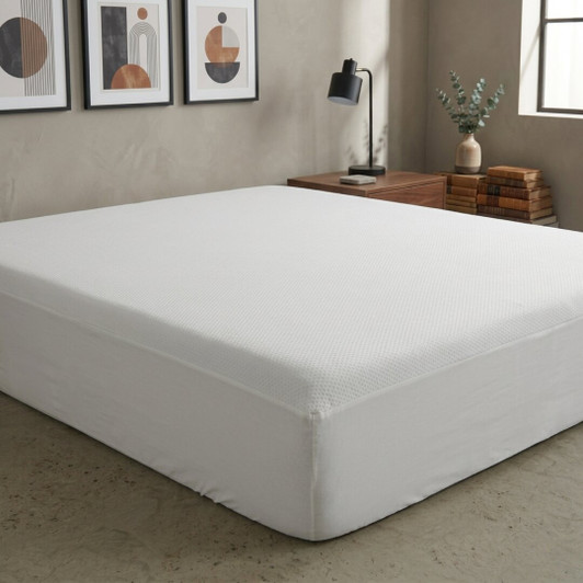 white-corovin-mattress-protector-fitted-on-bed-showing-breathable-protective-cover