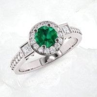 Diamond and emerald engagement ring by jewelry designer ASCHERON.