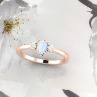 rose gold ring with pear shape moonstone and excellent cut white diamonds