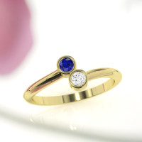 Yellow gold sapphire engagement ring. A expensive color blue sapphire ring with the whitest diamond. Both gems are excellent round cut.