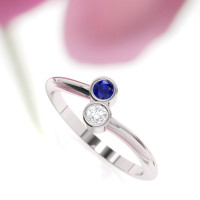 White gold sapphire engagement ring, this is a unique design by Irish jewelry designer Ascheron. Two gemstones ring.