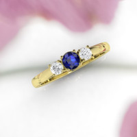 yellow gold sapphire engagement ring, handmade by Irish designer Ascheron. Perfect blue sapphire gemstone and two brilliant round cut diamonds. A classic piece of jewelry .