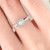opal ring on finger