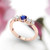 side view of rose gold diamond and sapphire ring. Blue sapphire with the whitest diamonds