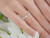 Marquise diamond ring on finger