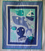 Under the Ocean Baby Quilt - Handcrafted
This cotton baby quilt features a shark, octopus, boat, whale, crab and submarine.
Approximately 42 x 32 inches