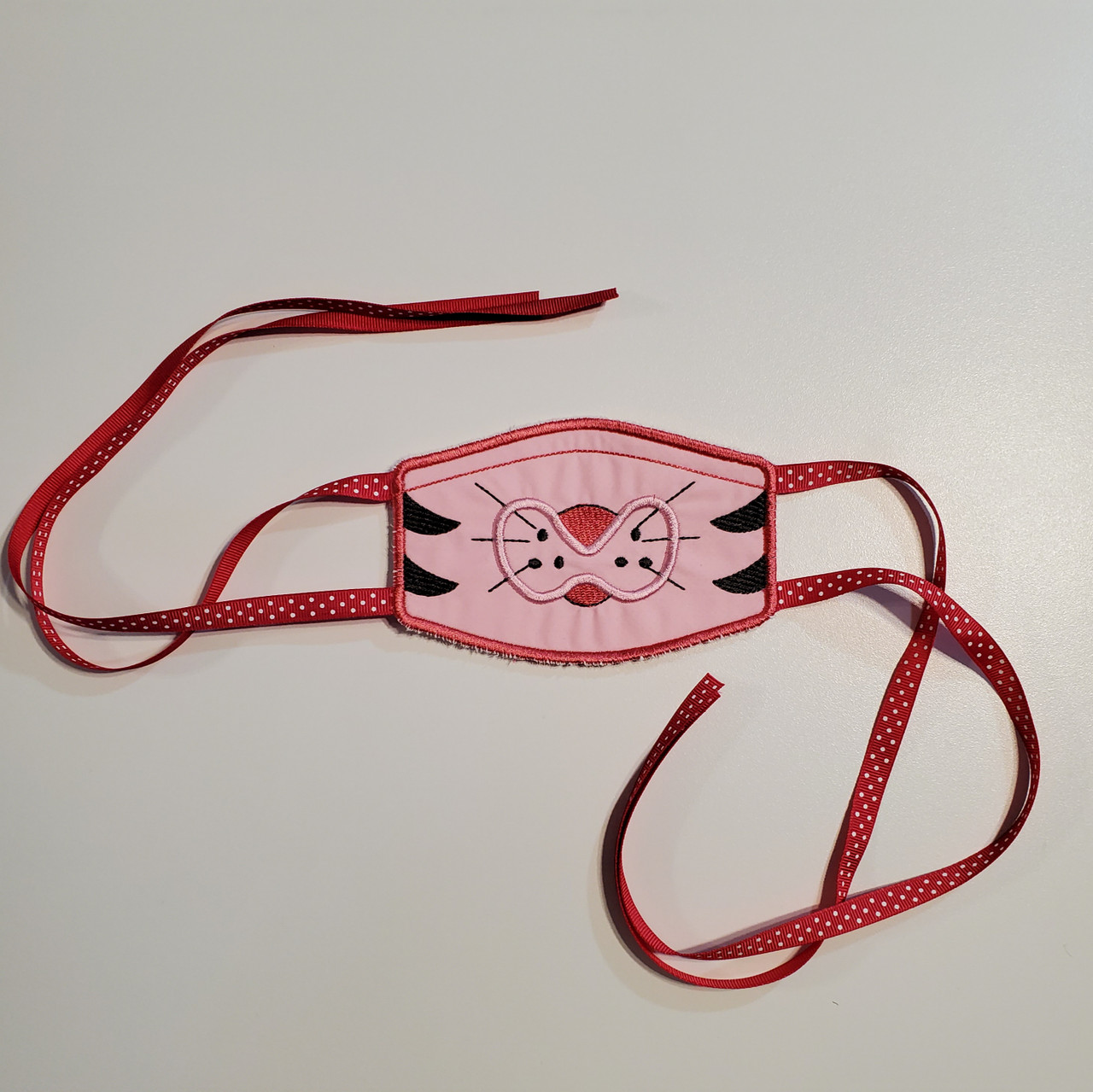 Face Mask - Three Layer - Reusable - Cotton - Handcrafted
Custom made with embroidered Cat with 3/8 inch wide and 16 inch long tie head straps.
Child