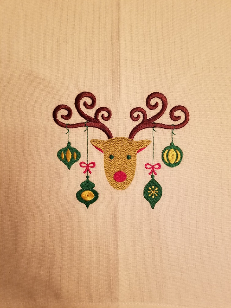 Ornament Reindeer 2 - Kitchen Towel - 20" x 28"
Embroidery on a white towel.
100% Cotton with loop, for optional hanging.
Machine washable in cool water and tumble dry at low temperature.
Minimal shrinkage.
Size: 20" x 28"