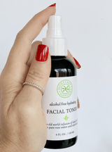 Facial Toner held in hand
