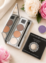 Eye Shadow Compact, shown partially filled with refill shadows 