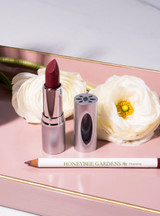 Lipstick and Lip Liner Bundle on cosmetic tray with flowers 