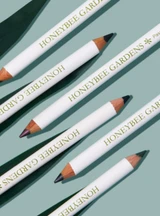 All 6 Effortless Eye Liners on teal background 
