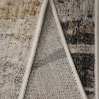 Aspre Shades Distressed Rug folded, exposing the backing.