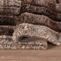 bronze shaggy rug folded