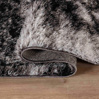 dark grey shaggy rug folded