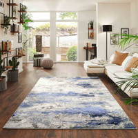 navy grey abstract rug in a living room