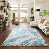 aqua grey abstract rug in a living room