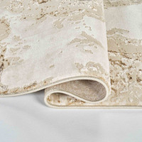 beige abstract rug runner folded on white floor
