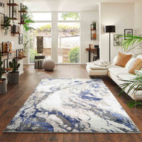 navy grey abstract rug in a living room
