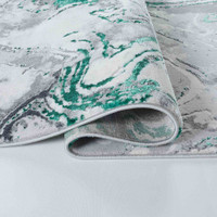 aqua grey abstract rug runner folded on white floor
