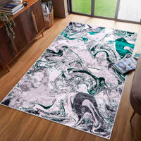 aqua grey abstract rug in a living room