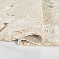 beige abstract rug runner folded on a white floor
