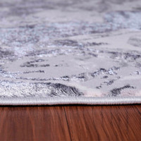 silver abstract rug closeup edge on wooden floor