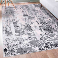 grey abstract rug in a living room
