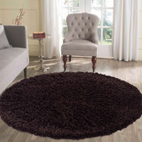 plain shaggy brown rug circle in a living room