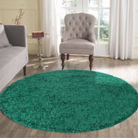 plain shaggy emerald circle rug in a living room