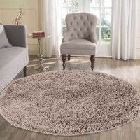 plain shaggy light beige rug circle in living room