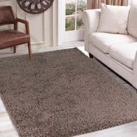 plain shaggy taupe rug in a living room